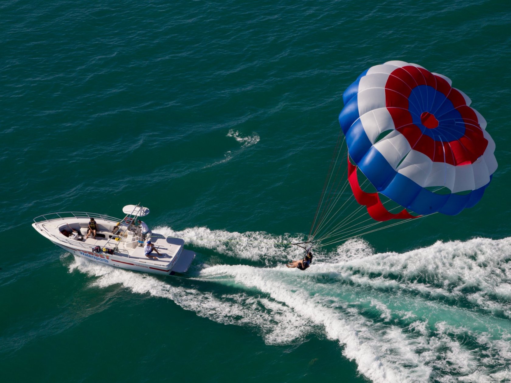 a person riding a wave on top of a body of water