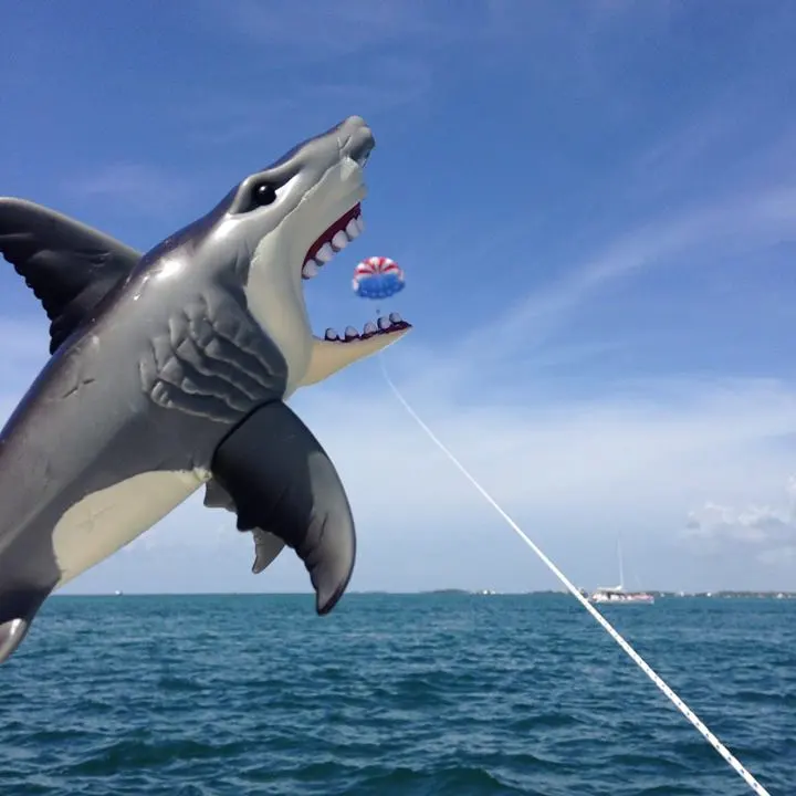 a man flying through the air over a body of water