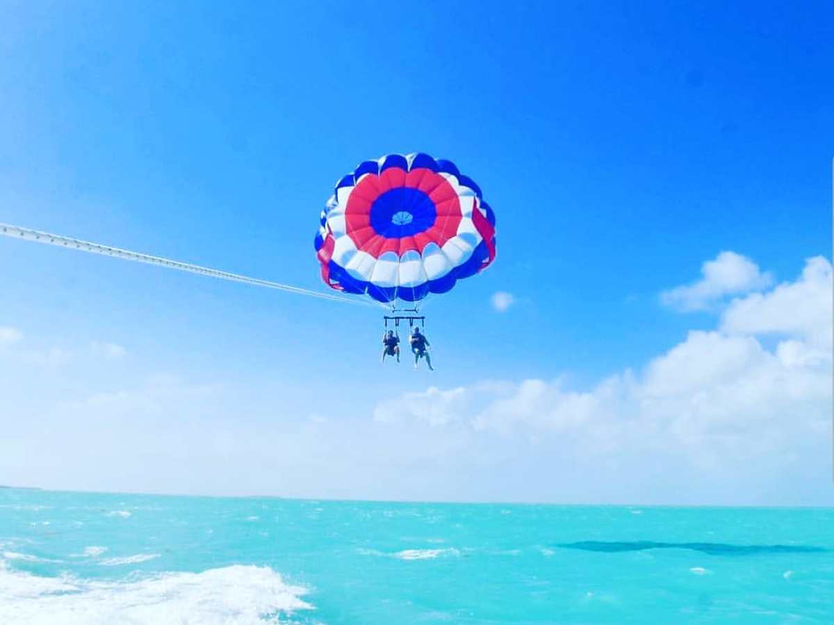 a man flying through the air while riding a wave in the ocean