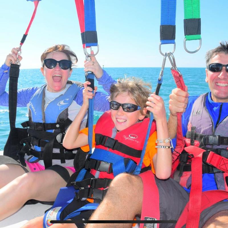 a group of people on a boat in the water