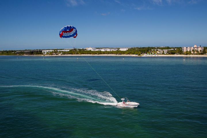 a man riding a wave on top of a body of water